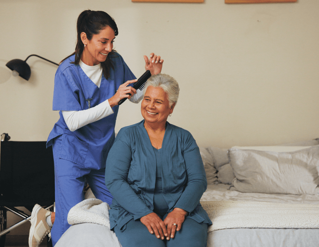 A nurse measuring an elderly woman's head circumference at home.